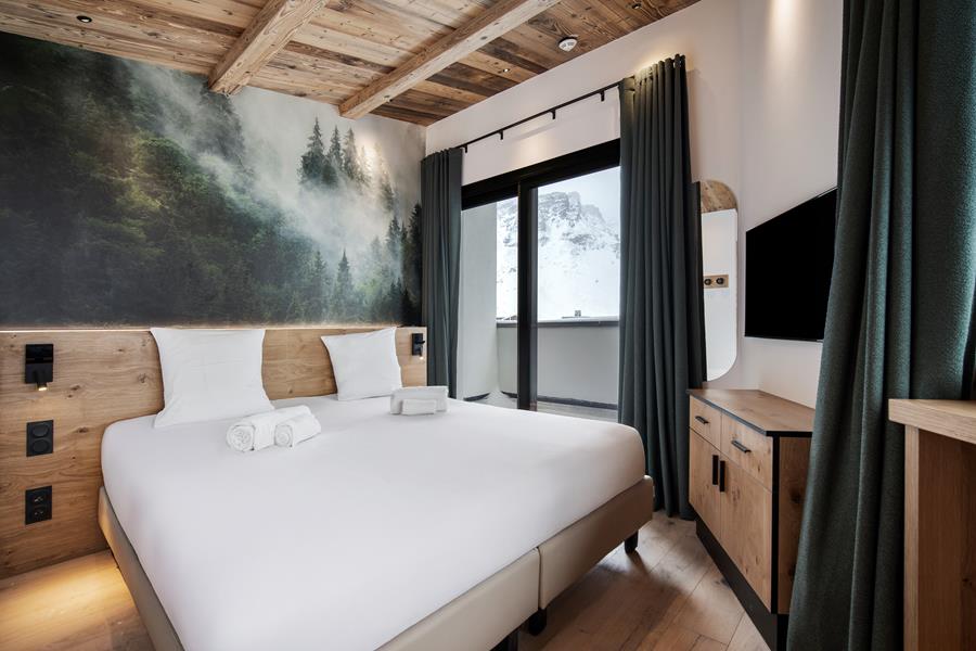 2 lits simples (90*200) avec TV et salle de bain attenante