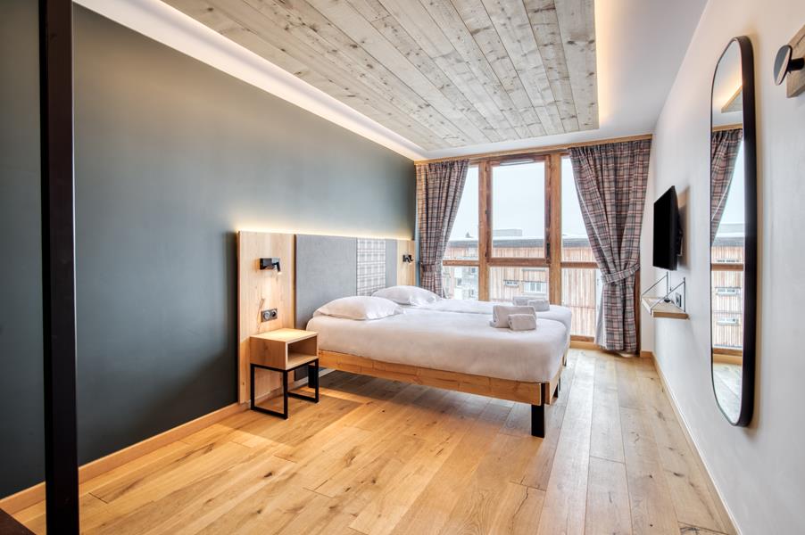 2 lits simples (90*200) avec TV + 1 lit d'appoint (1 pers.)